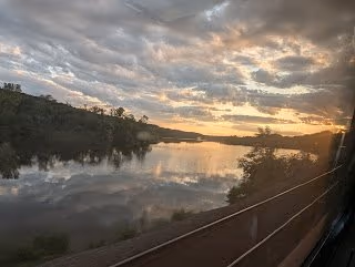 The Hudson River at dusk, seen from the train