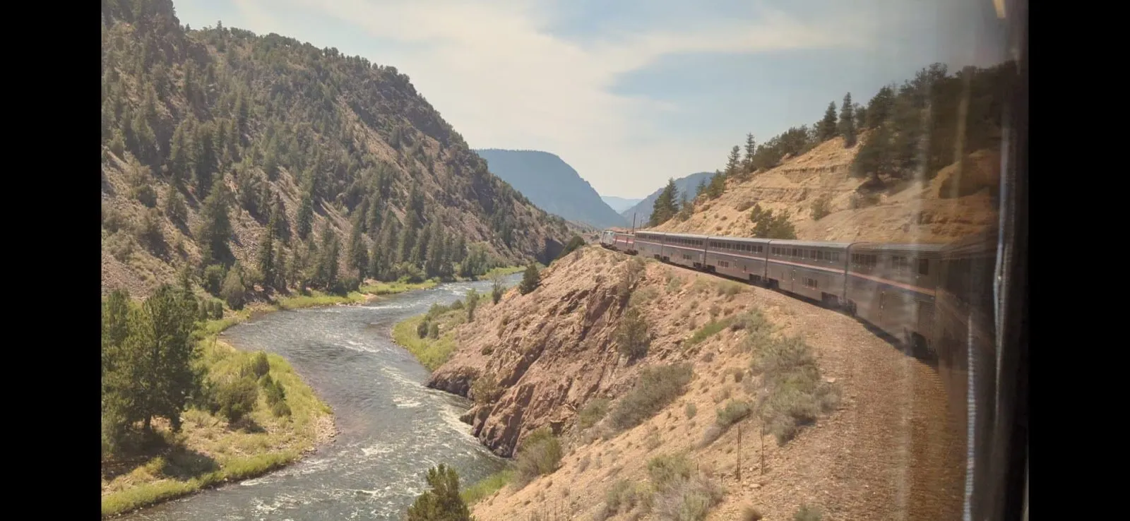 The Colorado River rushing past the train, as seen from the Sightseer Lounge