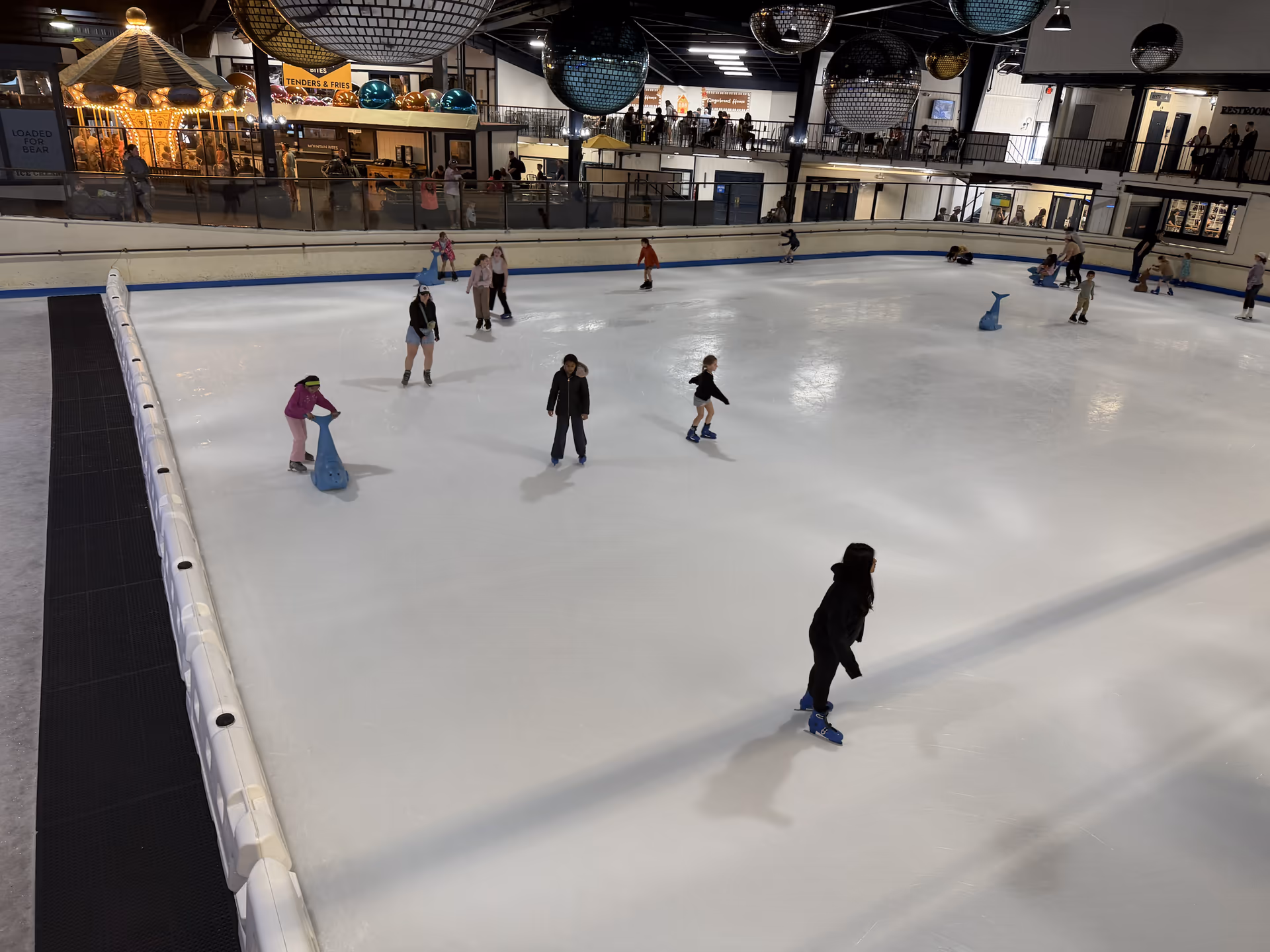 Ice skating rink at Ober Mountain with skaters spread across the ice