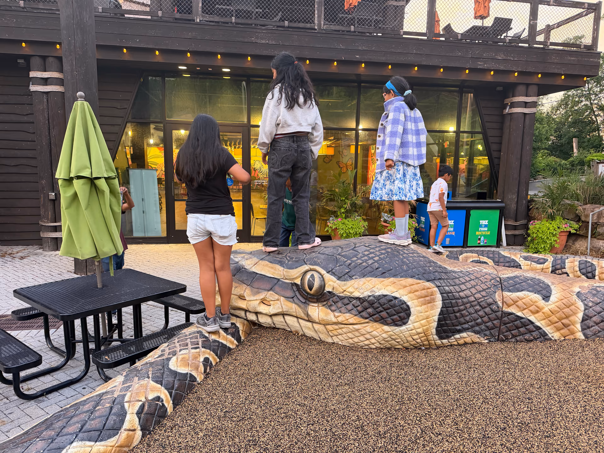 Large snake sculpture outside the reptile house area at Turtle Back Zoo