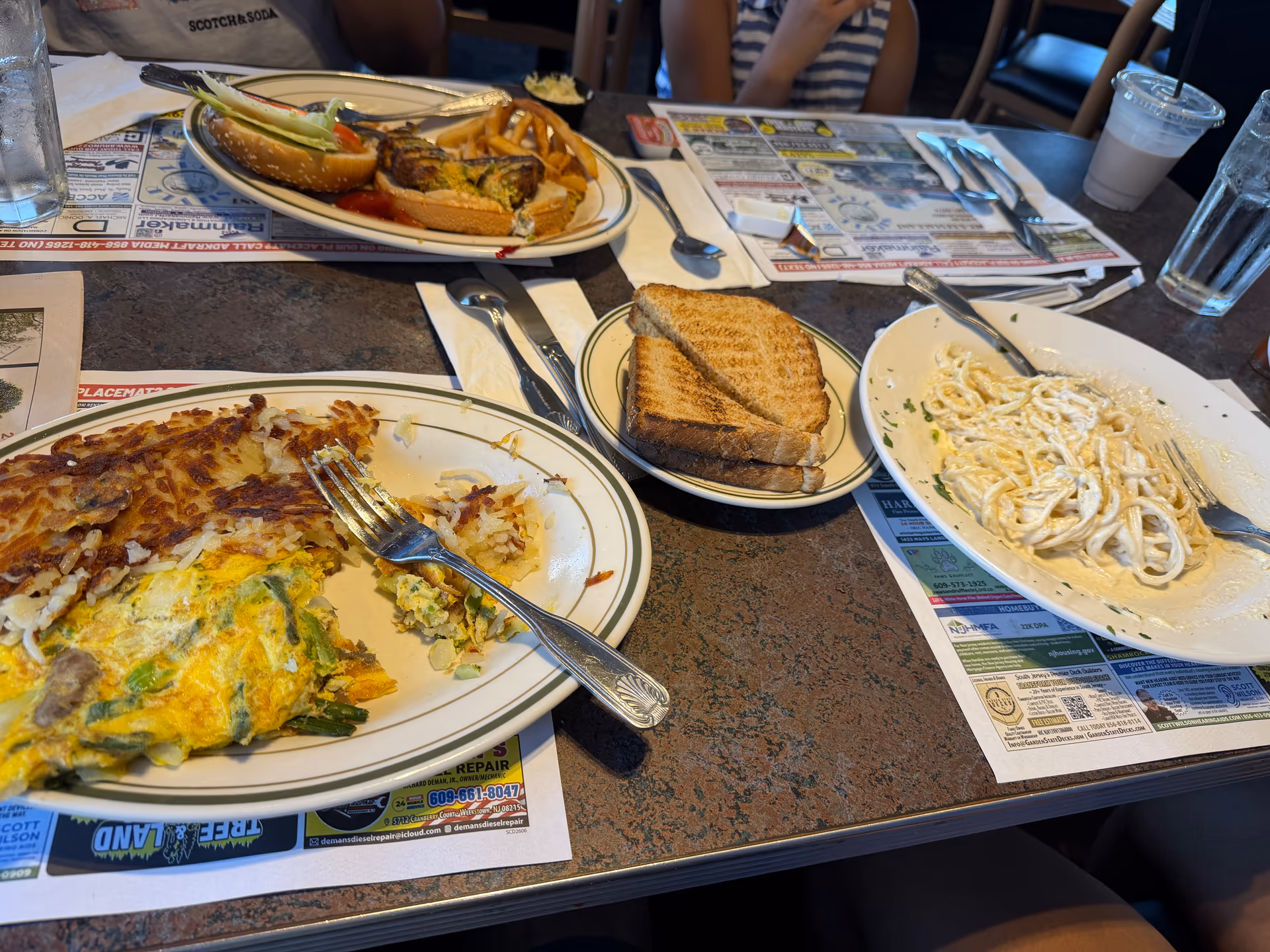 Several lunch plates spread across a diner table in Hammonton